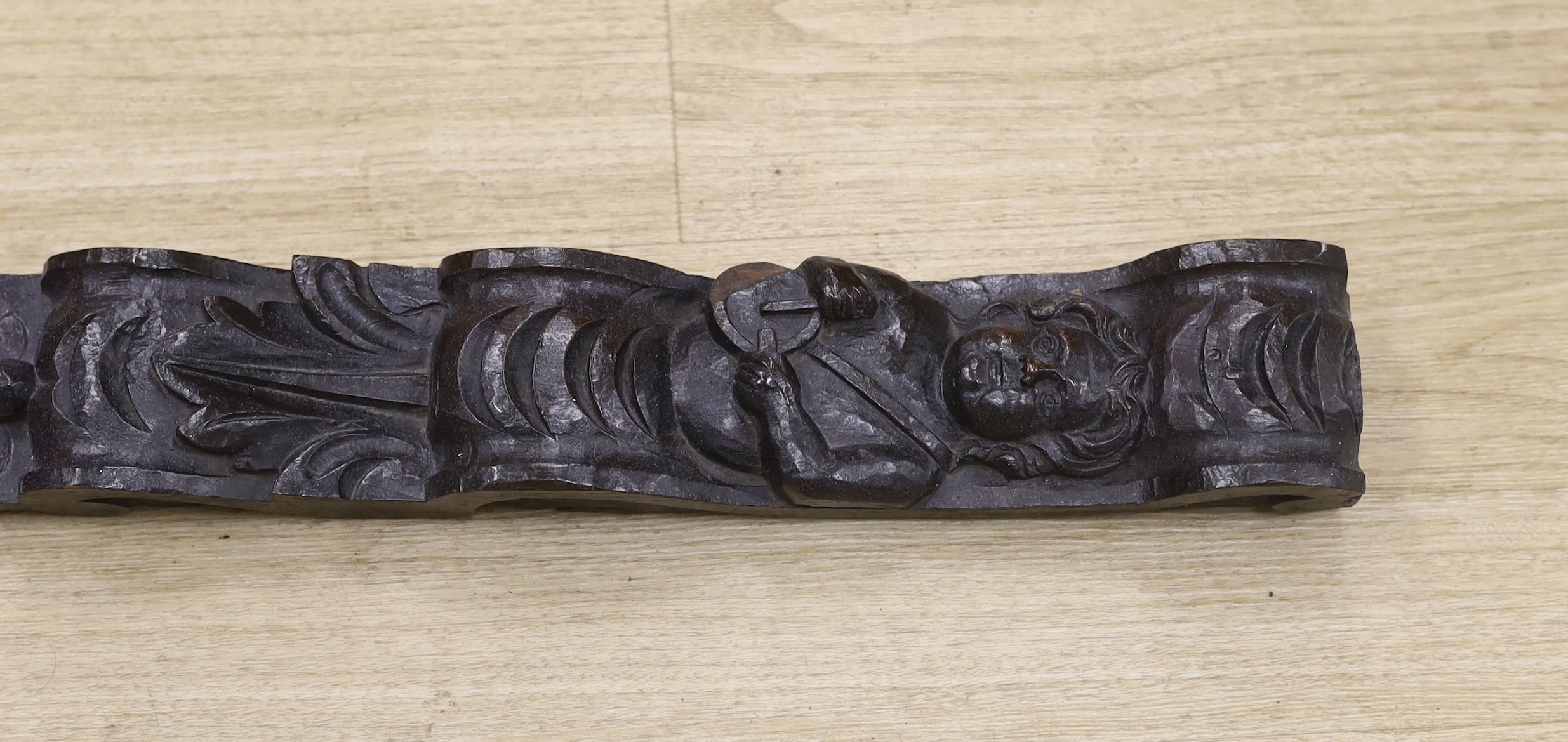 An 18th century carved oak figural pilaster, 83cm long